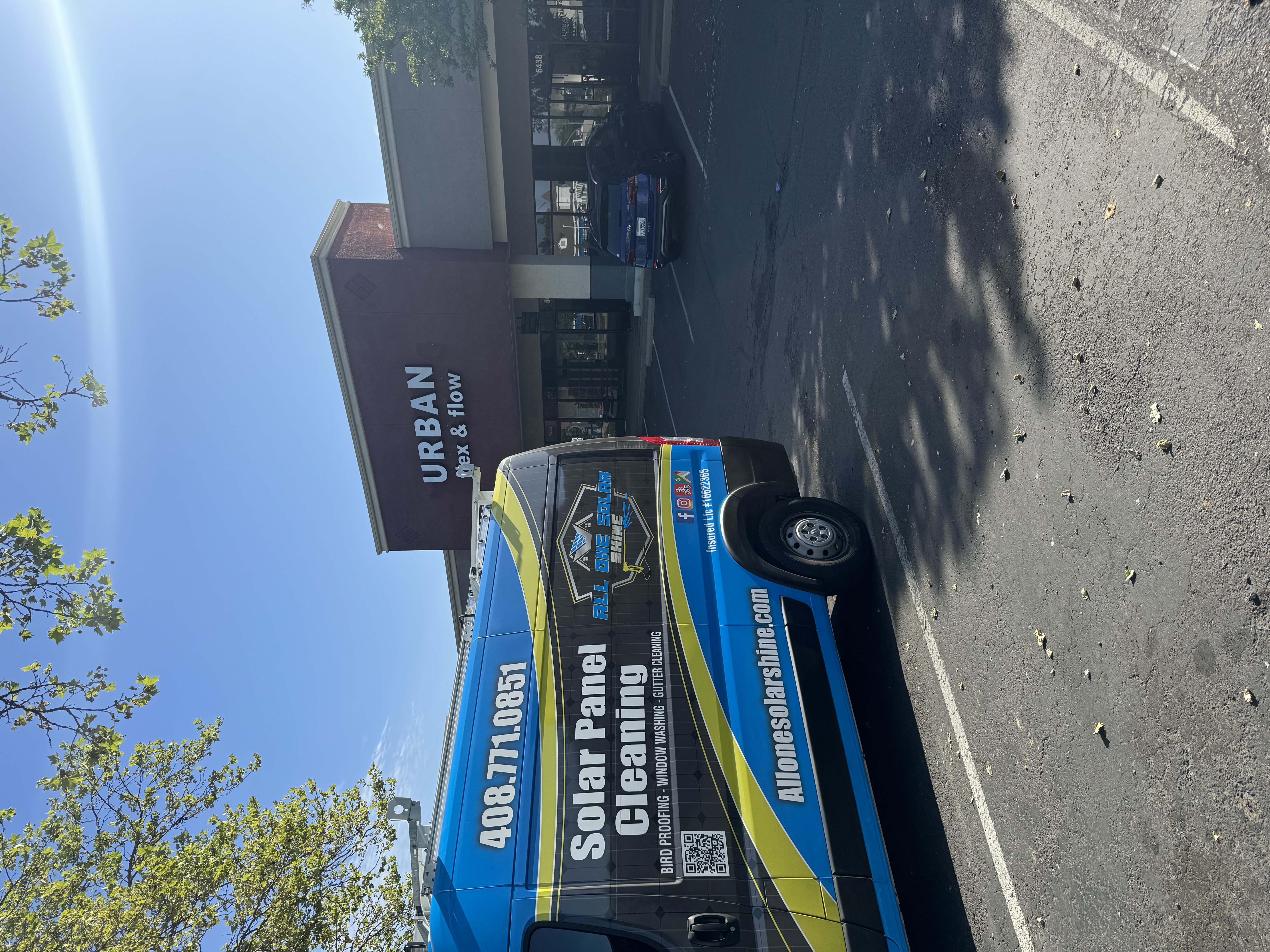 All One Solar Shine service van on a residential street